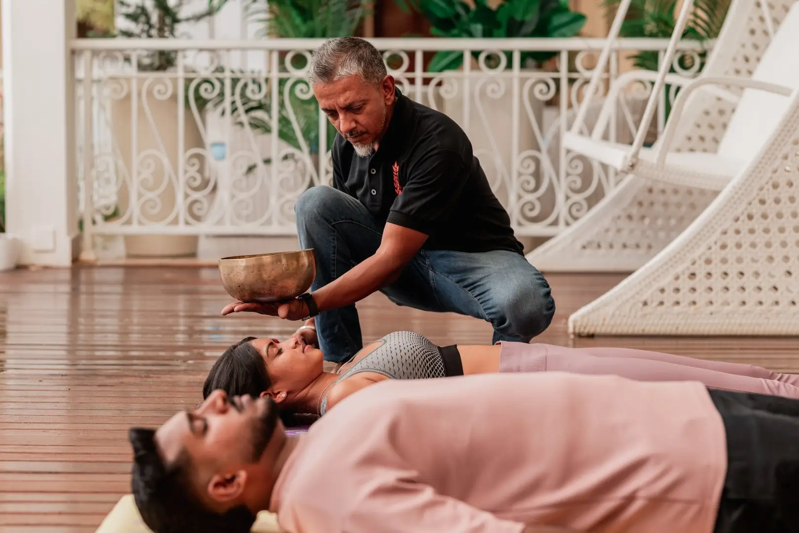 Therapist providing a restorative massage treatment outdoors