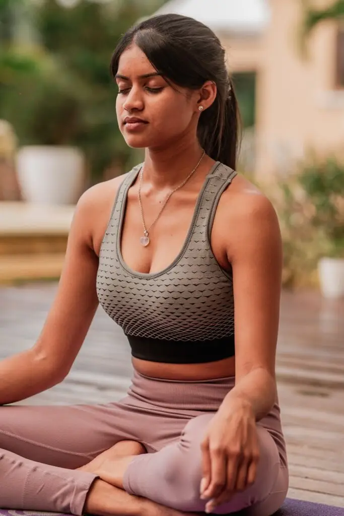 Guest meditating during a restorative wellness retreat in Mauritius