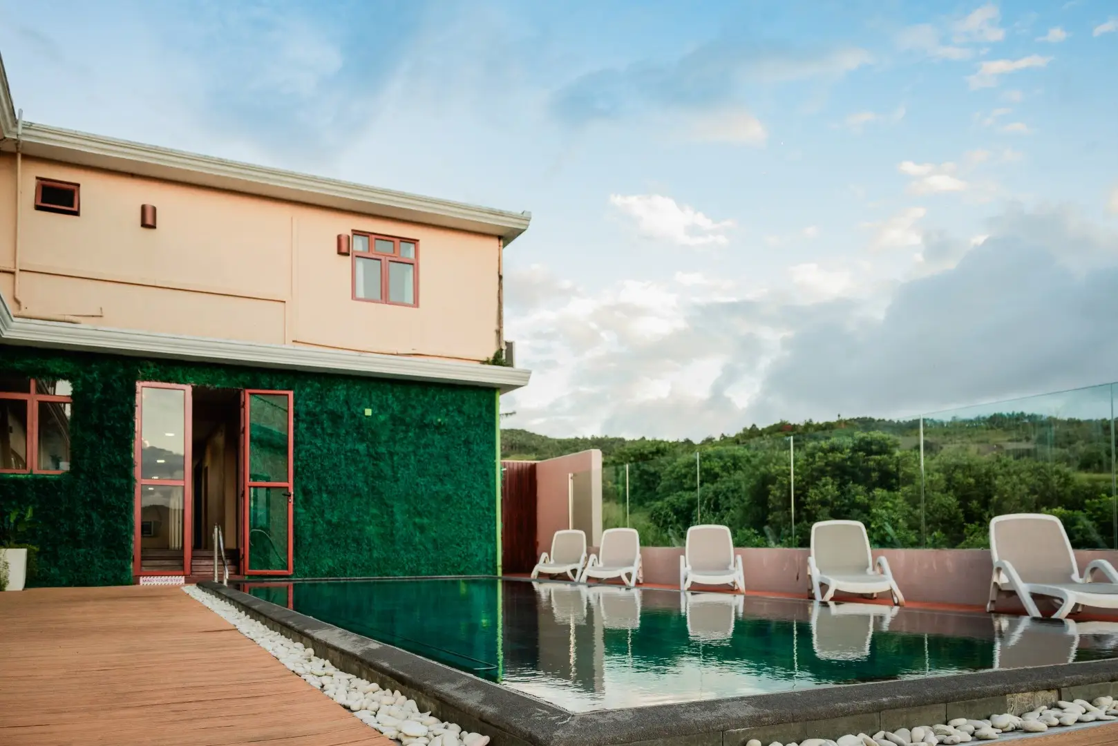 Outdoor terrace and guest accommodation at Olive Creek Wellness