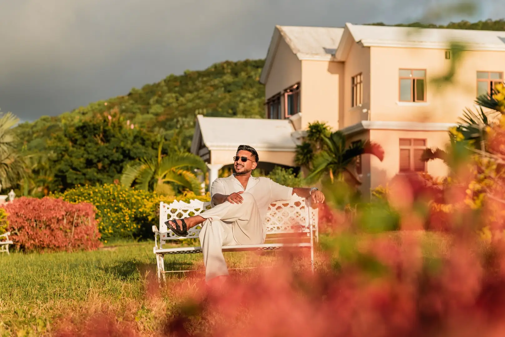 Guest relaxing in the gardens outside Olive Creek Wellness Retreat
