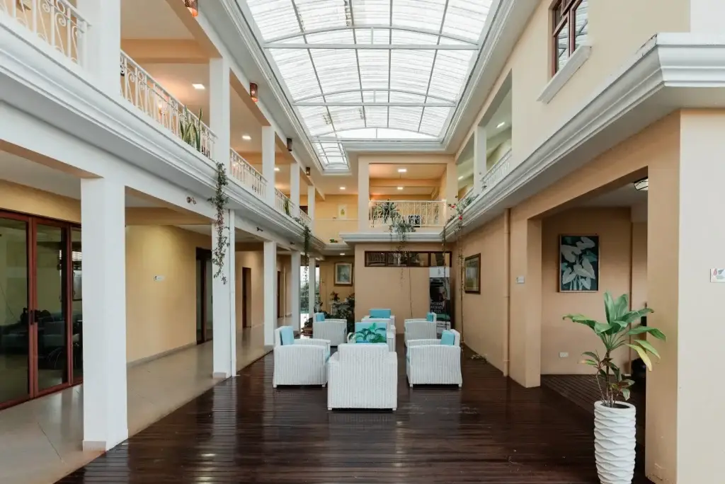 Olive Creek’s light-filled atrium with lounge seating and an overhead skylight
